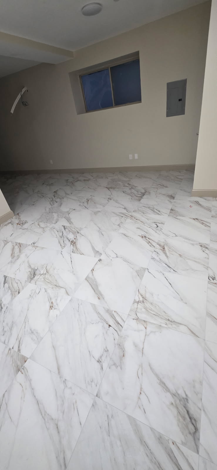 Completed large-format marble tile flooring installation